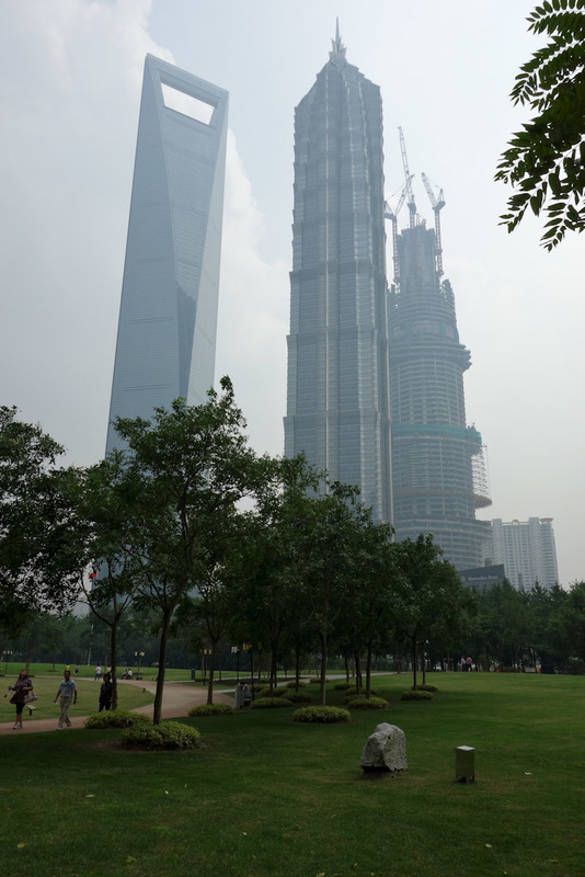 Back to China - Shanghai - Nanjing - Hangzhou - 2012 - And the 3 biggest buildings overlooking the park. I was up the very top of the bottle opener building a couple of weeks ago. If it fell over now it wo