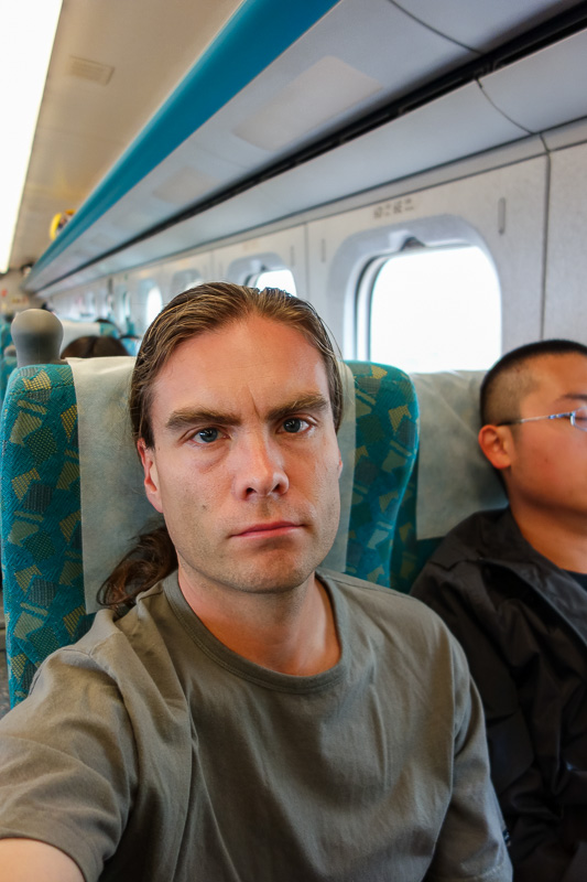 Hong Kong - Japan - Taiwan - March 2014 - Its me on the high speed rail, in a non black t-shirt, a rarity. This rail unlike Osaka really is high speed, it goes to 305kmph and stays there until