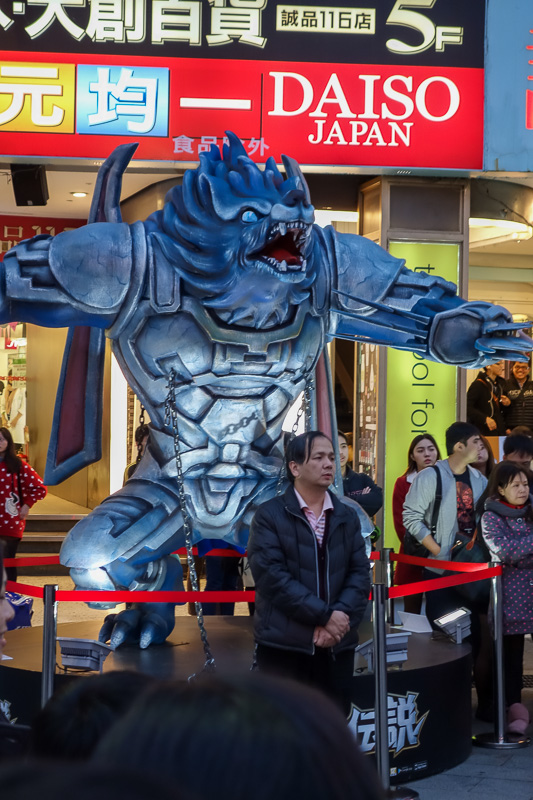 Hong Kong - Japan - Taiwan - March 2014 - Theres a huge crowd, except by this guy under the werewolf. He stands alone.