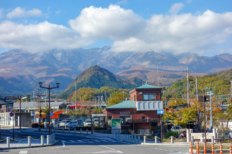 Japan-Nikko-Autumn-Bridge - Bonus photo of very impressive mountain range. A slightly bigger mountain is just to the left and behind it, Mount Nantai which is very popular among 