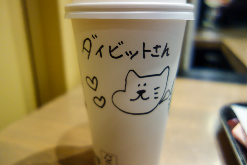 Visiting 9 cities in Japan - Oct and Nov 2016 - My regular morning coffee at Starbucks was differnt today in Kyoto, I got a picture and a message. I have no idea what it says, but the cat she drew s