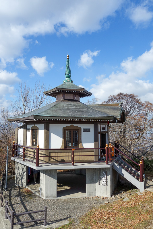 Japan-Sapporo-Hiking-Mount Moiwa - And now I am at the summit. Heres the temple. Theres also a 3 storey restaurant, tv towers, bus parking and the ropeway station.