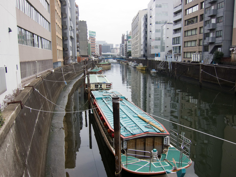 Japan and Taiwan March 2012 - There are many small canals running through Tokyo with canal boats such as these. However many of them are now in permanent shade as they make a great