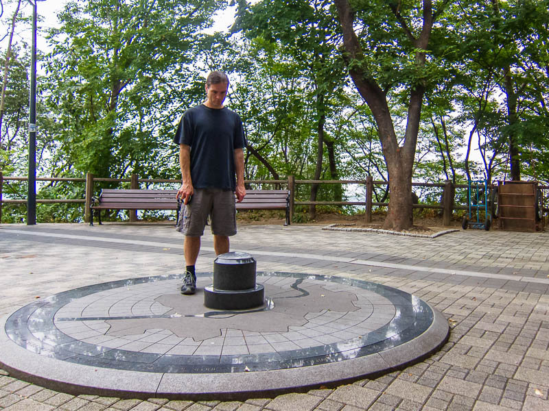 Korea-Seoul-Namsan-Tower - Here I am keeping an eye on the 'geographial centre of Seoul'. The entire city rotates around a pole inserted in the ground at this point on a giant p