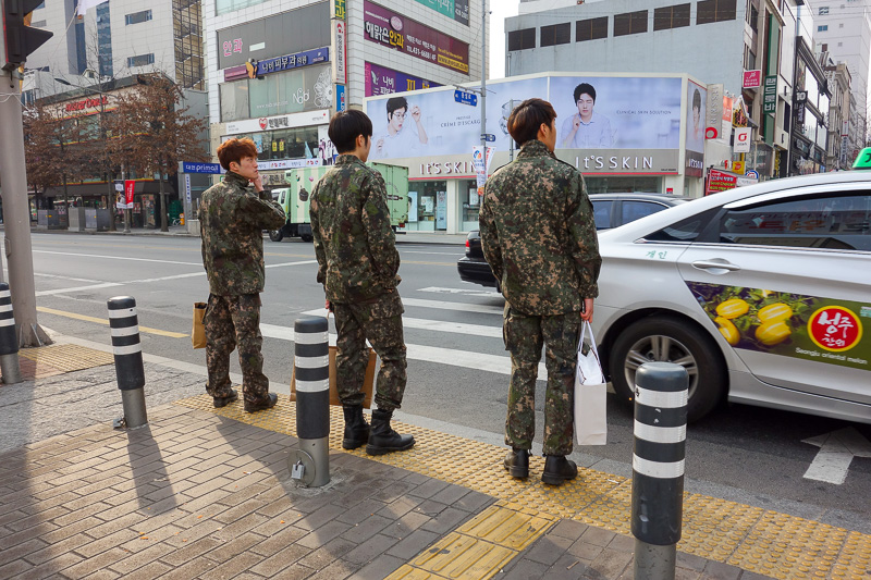 Korea again - Incheon - Daegu - Busan - Gwangju - Seoul - 2015 - Heres 3 Korean soldiers off to report for duty, carrying their beauty products.