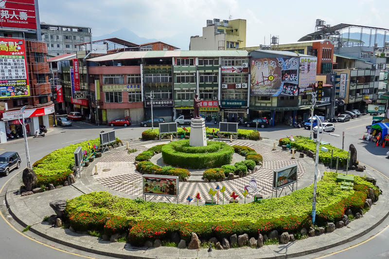 A full lap of Taiwan in March 2017 - My hotel has a wrap around balcony. I can keep an eye on this roundabout, one of many in down town Puli. Its where you can watch scooter roulette unfo