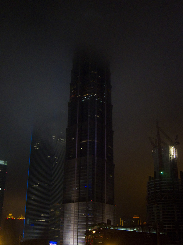 China November 2011 - From Shanghai to Beijing - A dark and sinister building dissapears into cloud. I never saw its top all evening.