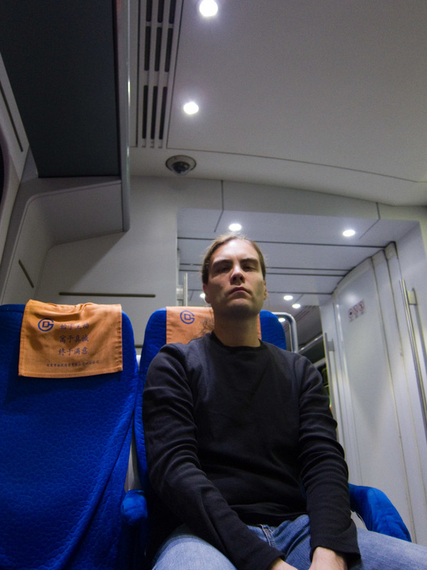 China-Beijing-Airport-Train-Lounge - Its me on the train, looking thrilled as usual. Actually I am, I am going to the airport!