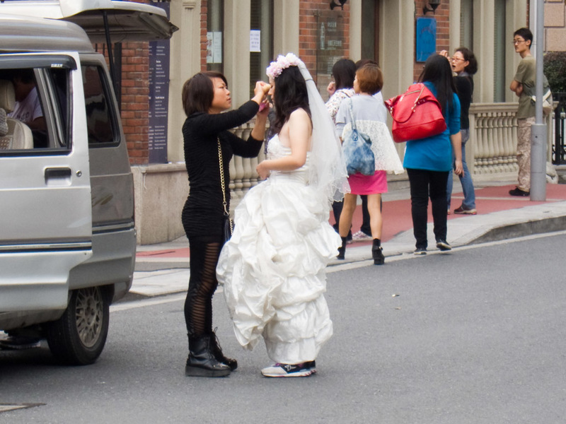 China-Shanghai-Xujiahui-Mall - This girl is getting married wearing sneakers.