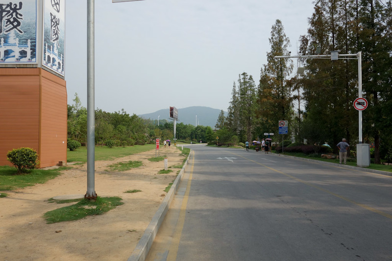 Back to China - Shanghai - Nanjing - Hangzhou - 2012 - Youre supposed to catch a bus, you can see the mountain in the distance. Not me. I stubbornly exercised my blisters for miles just to get to the start
