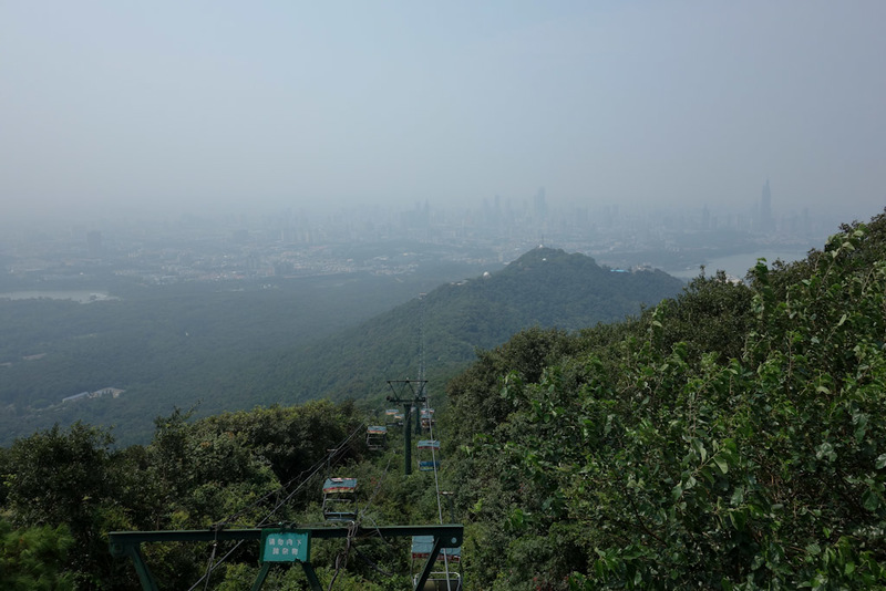 China-Nanjing-Hiking-Purple Mountain - Once at the top, you can look back on Nanjing. I think. Theres so much pollution haze its hard to tell. Theres a chairlift to go back down, I eventual