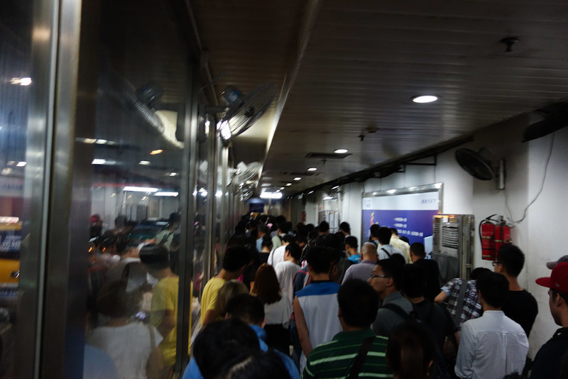China-Nanjing-Hangzhou-Train - The taxi waiting tunnel. I am near the front of the queue by the time I took this photo, it was probably 100 metres long like this squeezed into this 