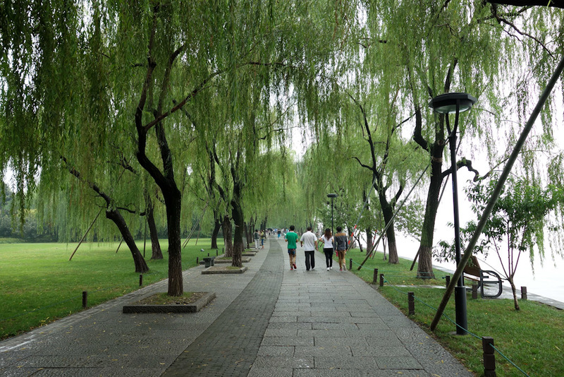 Back to China - Shanghai - Nanjing - Hangzhou - 2012 - This is the path. Theres trees all the way around and generally a couple of hundred metres of park. On the far side of the lake there are mountains, w