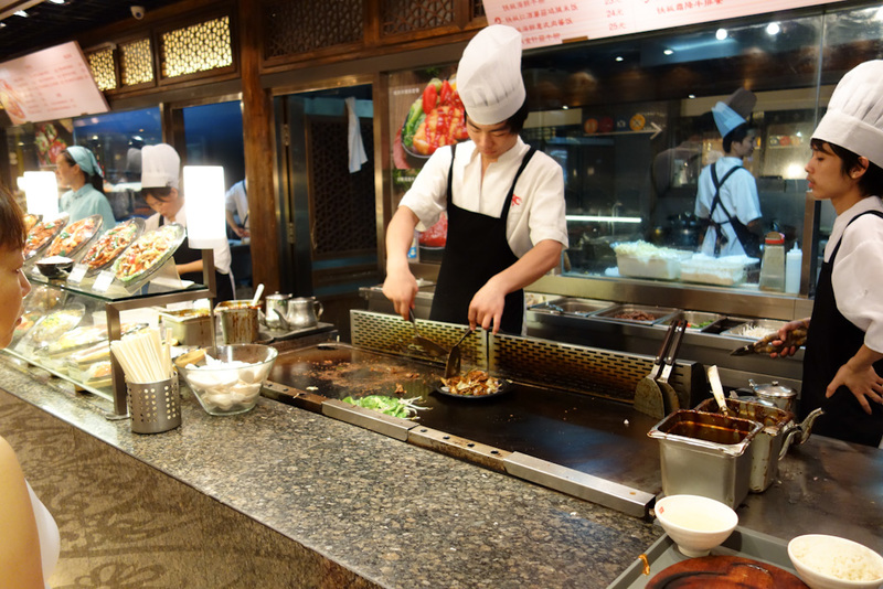 China-Shanghai-Xujiahui - Rather than show you my dinner, I will show you it being prepared. It may be a foodcourt but everything gets made from scratch while you wait, with a 