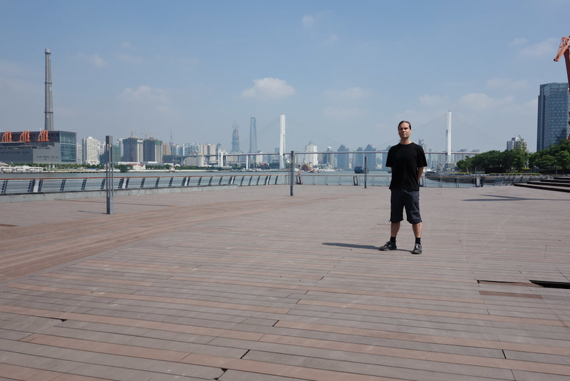 China-Shanghai-Expo-Ferry - Its me in the abandoned water front area. You can see one of the holes down to the water below in the foreground. It is a spooky place being there on 