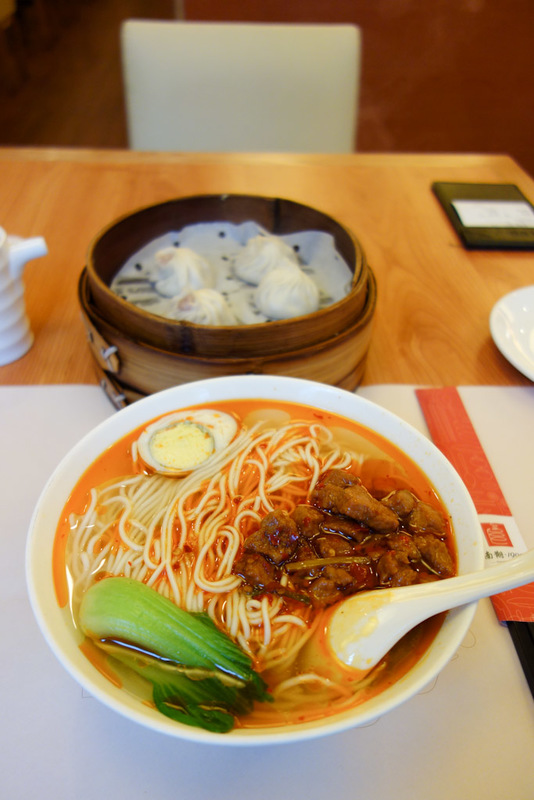 China-Shanghai-Market-Airport - My last meal, noodles and dumplings from 1900. This time the noodles come with pork and chilli oil. The dumplings are 2 normal pork ones and 2 crab on