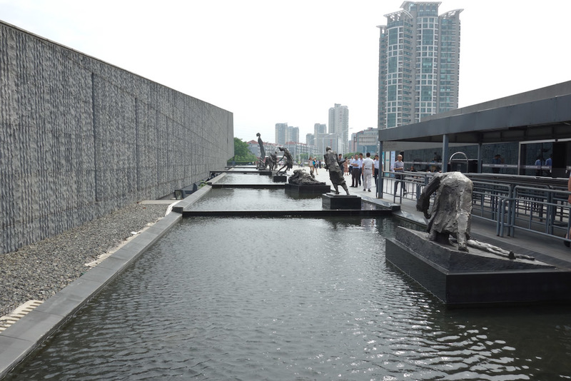 China-Nanjing-Massacre-Museum - Lake with many of the statues.