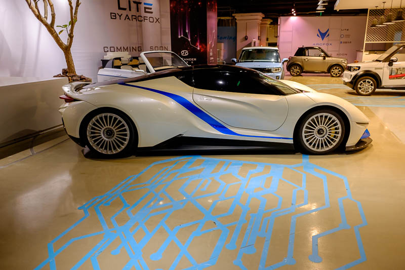 China-Beijing-Sanlitun-Food - Nearby is a car dealership for future electric cars that dont exist yet. You know they are electric because they have used an exciting electric blue p