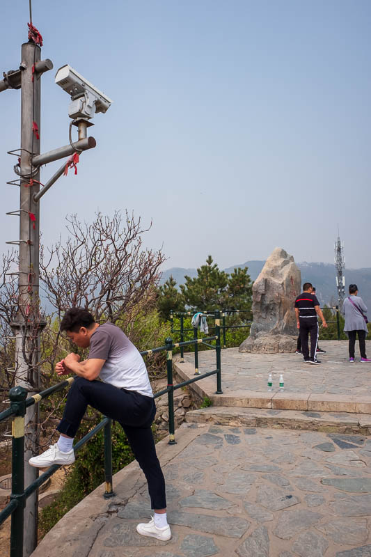 The great loop of China - April 2018 - Here we have the summit rock marker, and a large citizen monitoring camera tower to make sure everyone behaves in a harmonious manner. Swearing will g