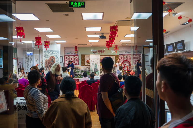 The great loop of China - April 2018 - I passed an art auction. I get the feeling it was all staged to lure tourists. The auction was being conducted in English.