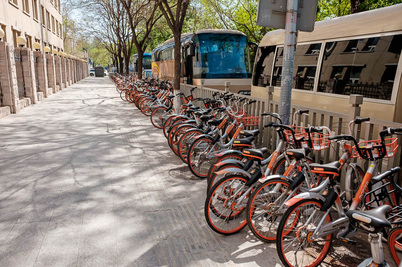 China-Beijing-Wangfujing-Sunshine - Here is the competing orange brand of dockless bicycles. Now there definitely seems to be some form of organisation going on, they seem to have turf a