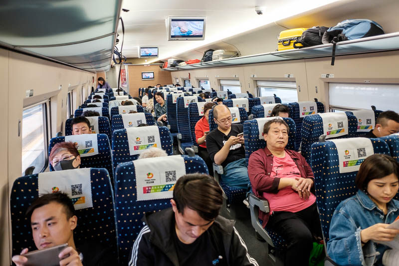 China-Beijing-Zhengzhou-Bullet Train - The inside of the train. These are very long trains, there are 3 classes, I am in the cheapest class of course, I travel among the people. There are a