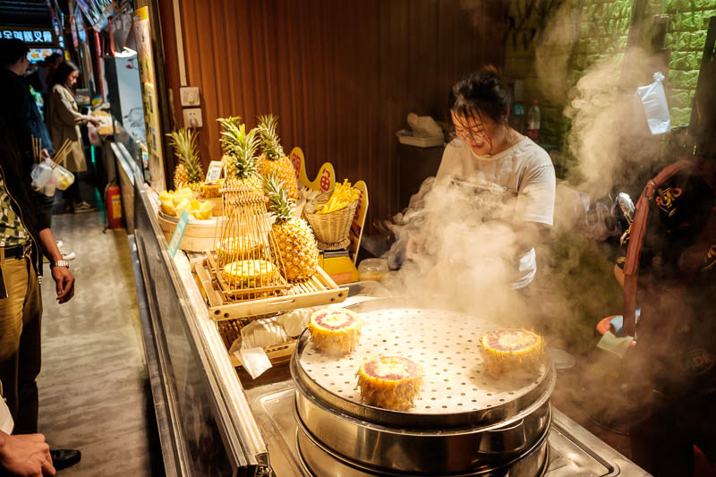 The great loop of China - April 2018 - It seems it is pineapple season, heres another pineapple rice stall, but there were people dancing around selling pineapples in the street too.