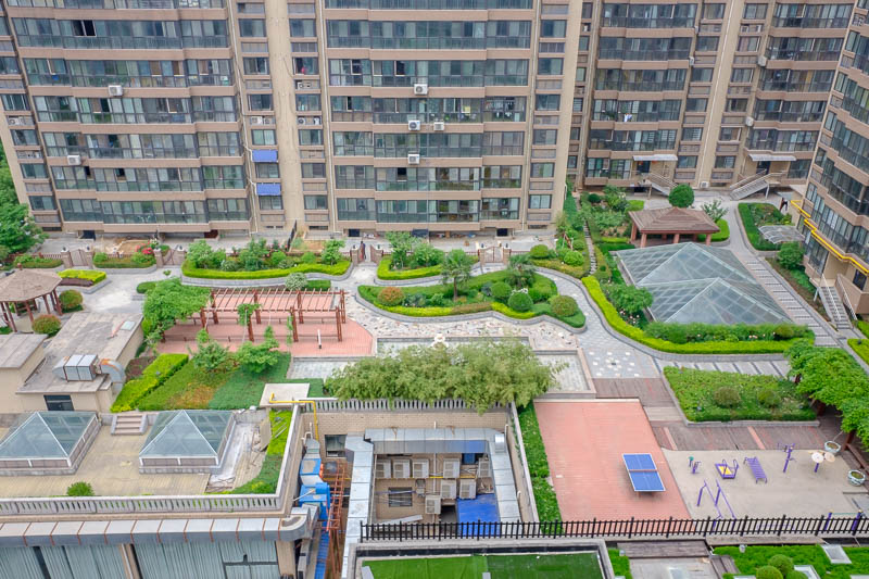 China-Zhengzhou-Xian-Bullet Train - This is the view out of my hotel this time, I guess those are the shared gardens for the apartments surrounding them, with skylights into the car park