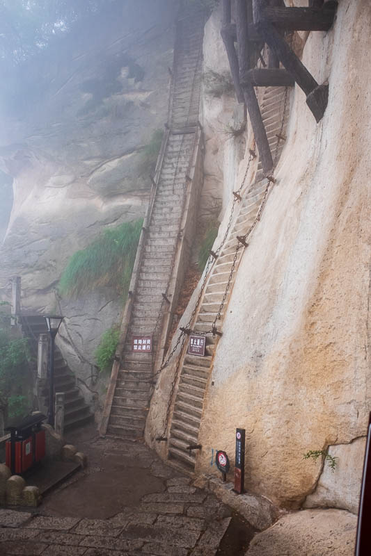 China-Hiking-Rain-Huashan-Soldiers Path - This is a famous spot on the trail, the 80 degree steps. As you can see theres a couple of different options for how steep you want to go. Also note t
