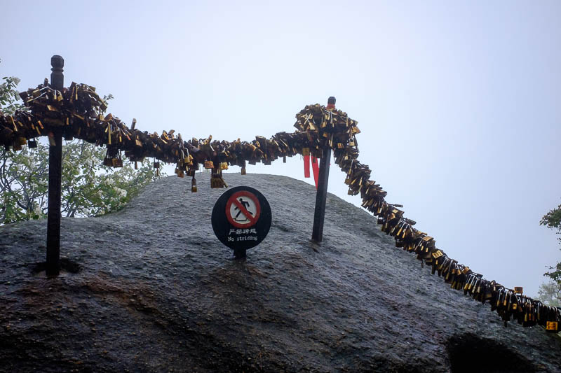 China-Hiking-Rain-Huashan-Soldiers Path - Time to keep climbing and look at a lot of padlocks. I had my lock picking kit with me so removed about 20 and hurled them off the cliff.