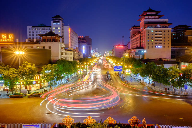 China-Xian-City Wall-Hiking-Dumplings - Here we have a long exposure looking south from the old train station. Buses do a U turn here, hence the cool light trails.