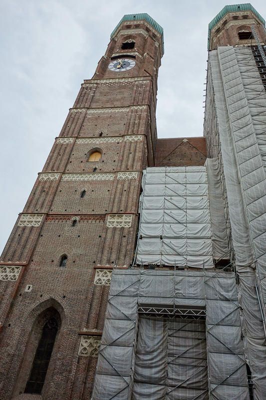 Germany-Munich-Rain - This is presumably a church, under reconstruction of course, but it has no crucifix's. Such buildings are quite common, and usually have clocks. Munic
