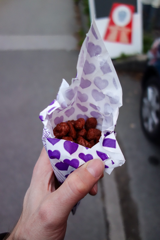 Germany-Garmisch Partenkirchen - The petrol station delivered, they were selling paper cones filled with hot candied nuts. They sit on a heated metal tray to keep them warm. They have
