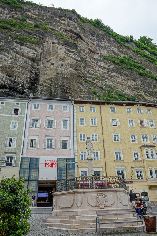 Austria-Salzburg-Mozart-Sausage - Now we start to see cliffs, these buildings back onto the cliff, but I think you can walk through to the other side of the cliff.