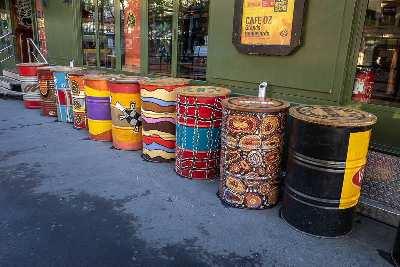 France-Paris-Sightseeing - Cultural misappropriation. This Australian themed alcohol consumption building has painted some 44 gallon drums with fake aboriginal art. Thats a poin