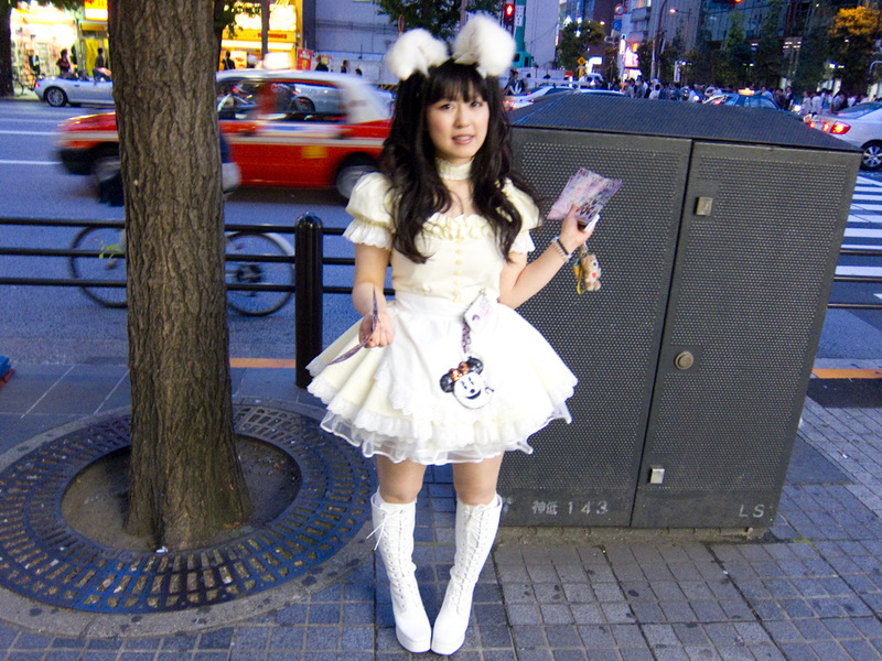 Japan-Tokyo-Ginza-Akihabara - Another maid, but note how she is standing. I have noticed that many Japanese girls walk like this, like they are almost crippled. Why is this? Guys d