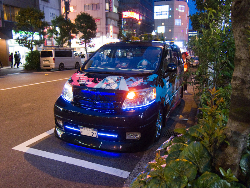Japan-Tokyo-Ginza-Akihabara - There are many cars painted in a tribute to various manga type things. Vans are the most popular to paint like this, just like the USA do with crappy 