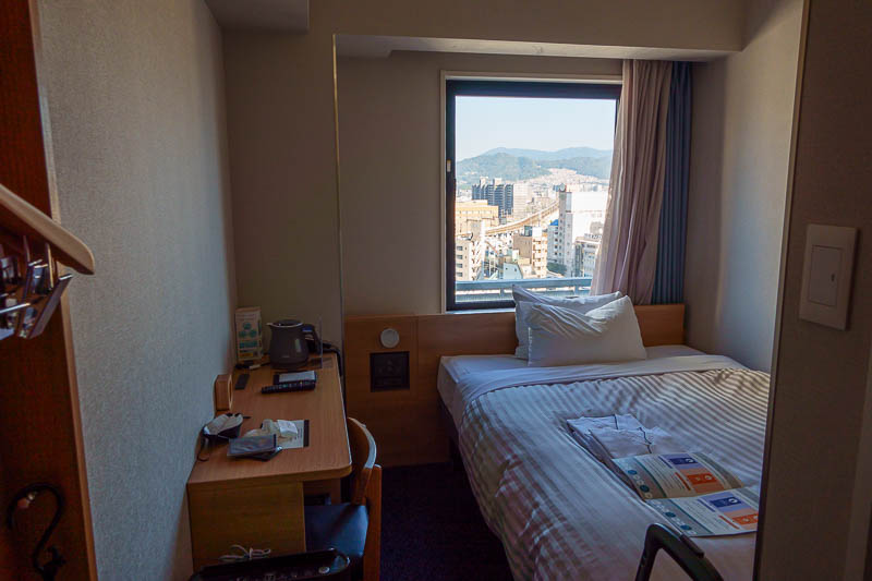 Japan-Tokyo-Hiroshima-Shinkansen - And now as a special treat, multiple hotel room related photos. The first is my room. Much the same as the last, except the tv is on the wall at the f