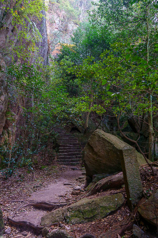 Japan-Hiroshima-Hiking-Miyajima - Lots of dark areas with huge moss covered rocks. Why is there no one around? This should be one of the busiest days of the year.