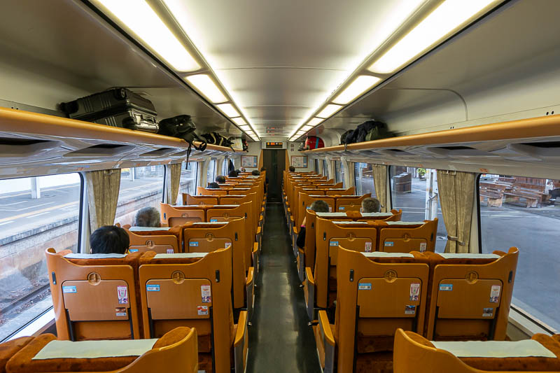 Japan-Matsuyama-Osaka - The inside of my train, which is the modern looking train in the above photo, is very orange, and the toilets are no flush squatters. Have fun with th