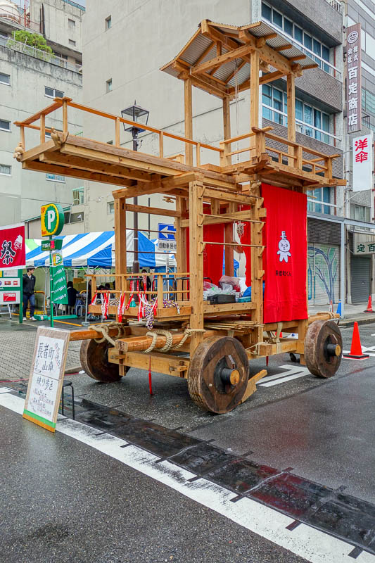 Japan-Nagoya-Rain-Toyota - Presumably, the highlight of todays festival. At some point shirtless men will push this through the streets and run people over to appease the earthq