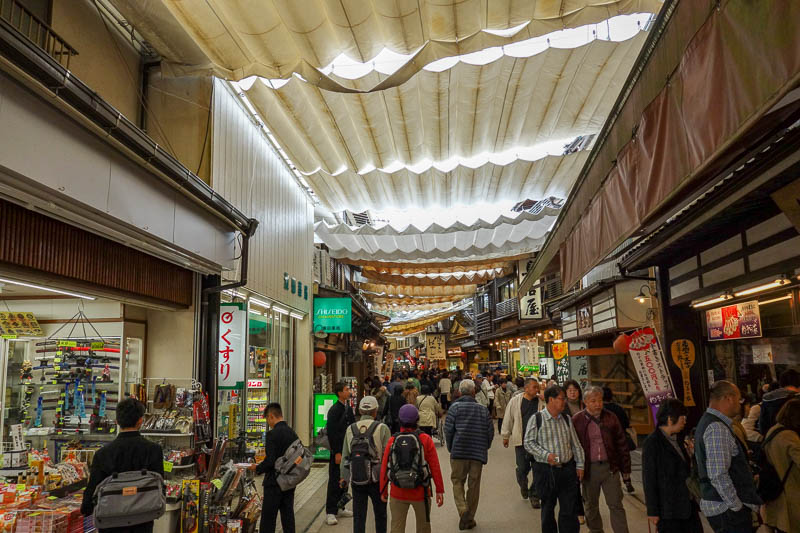 Japan 2015 - Tokyo - Nagoya - Hiroshima - Shimonoseki - Fukuoka - There is an extensive tourist shopping area to buy chopsticks and glass jewelry and food on sticks.