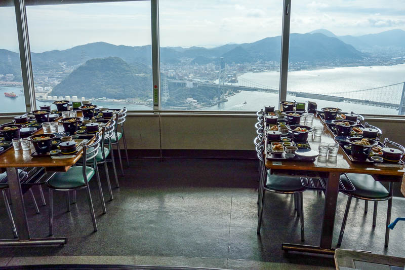 Japan-Shimonoseki-Hiking-Shrine-Hinoyama - There is a revolving restaurant to appreciate the great view. There is food on every table but no people? Maybe they have a booking and the bus is on 