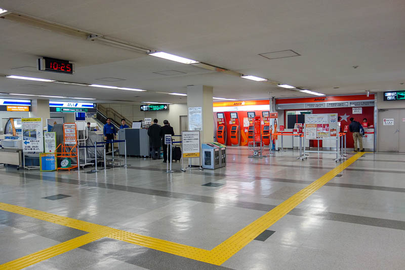 Japan-Fukuoka-Tokyo-Airport - The Jetstar check in area, just 2 counters. They wouldnt let me check in until 2 hours before my flight. Yes I was early. So I had to wheel my bag aro