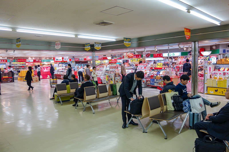 Japan 2015 - Tokyo - Nagoya - Hiroshima - Shimonoseki - Fukuoka - The shops in the old terminal 3. Actually the shop area makes it look much newer than it is.