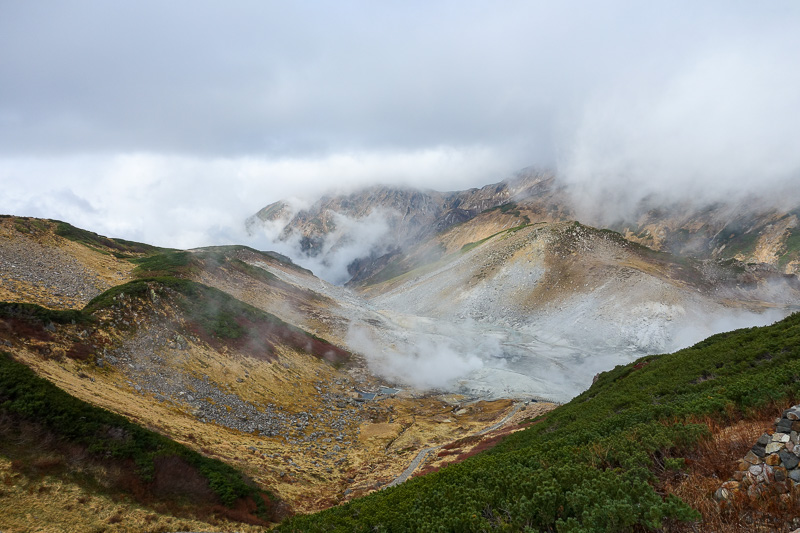 Japan-Tateyama-Kurobe-Alpine-Hiking - Optical illusion, thats looking down at cloud, but theres also steam and gas coming out of the ground.