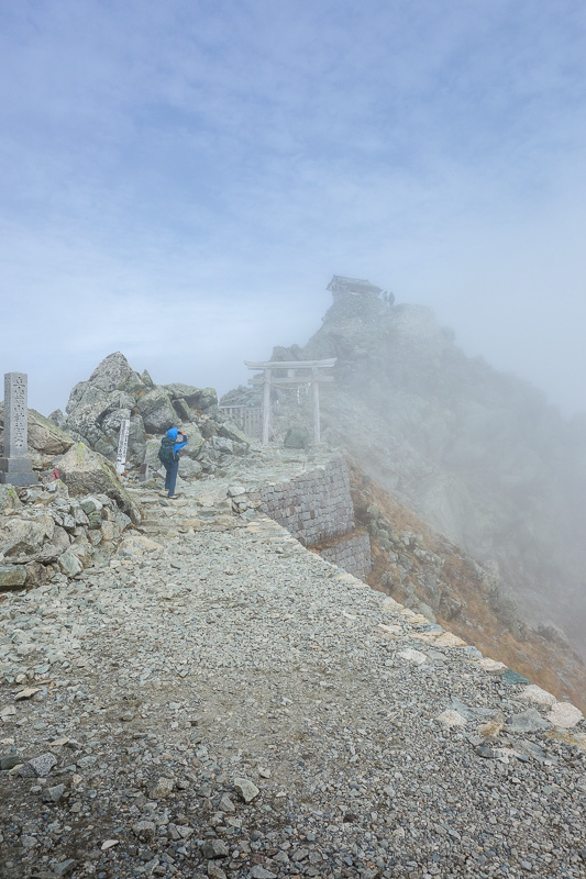 Japan-Tateyama-Kurobe-Alpine-Hiking - This is the path to the summit shrine, the light gives it an end of the world aura.