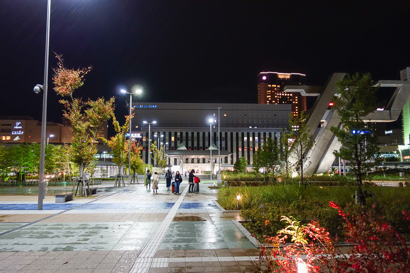 Visiting 9 cities in Japan - Oct and Nov 2016 - The far side of the station is just a few hotels and bus parking, but made for a nice photo in the rain. It is strange rain, very big drops, very infr