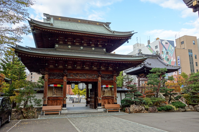 Japan-Sapporo-Hakodate-Train - Taxi car park has a small shrine and garden.