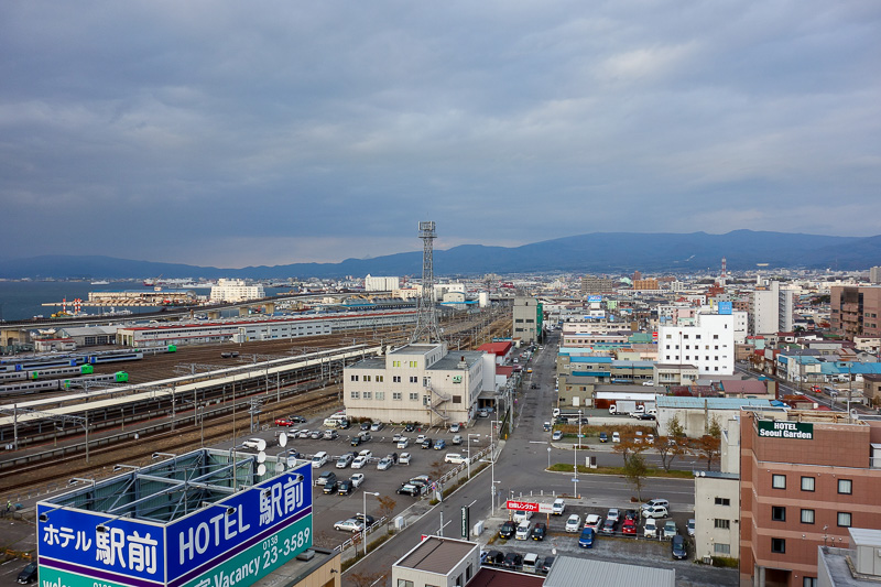 Japan-Sapporo-Hakodate-Train - I can keep a close eye on the trains coming and going, and the mountains in the distance.